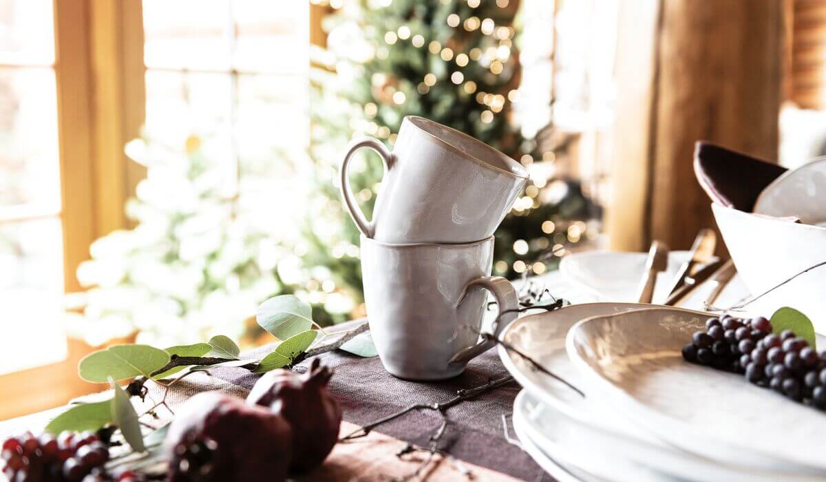 two Burlington Cloud mugs set across a holiday table