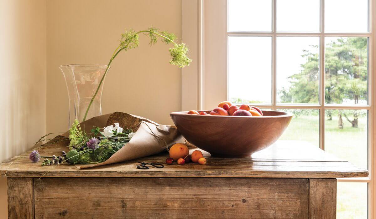 Large Cherry Wood Champlain Bowl featured for summer table with vase and flowers